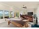 Bright game room with pool table and water views at 3310 John Anderson Dr, Ormond Beach, FL 32176