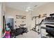 Bright home gym with modern exercise equipment, including a treadmill and weightlifting station at 3310 John Anderson Dr, Ormond Beach, FL 32176
