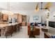 Open concept living room featuring large kitchen, decorative ceiling fan, and modern decor at 3310 John Anderson Dr, Ormond Beach, FL 32176