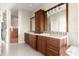 Elegant main bathroom with dual sinks and wood cabinetry at 3310 John Anderson Dr, Ormond Beach, FL 32176