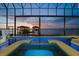 Indoor pool with hot tub overlooking the waterfront and private boat dock at 3310 John Anderson Dr, Ormond Beach, FL 32176