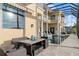 Enclosed pool area with outdoor seating, dining, and clear views at 3310 John Anderson Dr, Ormond Beach, FL 32176