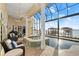 Enclosed pool area with spa, seating, ceiling fans, and views of the intercostal waterway at 3310 John Anderson Dr, Ormond Beach, FL 32176