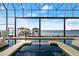 Enclosed pool with a spa and clear views of the intercostal waterway at 3310 John Anderson Dr, Ormond Beach, FL 32176
