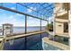 Enclosed pool with spa and view of the intercostal waterway at 3310 John Anderson Dr, Ormond Beach, FL 32176