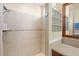 Bright shower stall with glass block and stone tile at 3310 John Anderson Dr, Ormond Beach, FL 32176