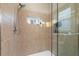 Modern walk-in shower with tile walls, glass door, and chrome fixtures at 3310 John Anderson Dr, Ormond Beach, FL 32176