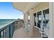 Wide balcony view of the ocean, featuring a tiled floor and comfortable seating perfect for relaxation at 3425 S Atlantic Ave # 1206, Daytona Beach Shores, FL 32118