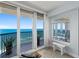 Relaxing space overlooking the ocean, featuring sliding glass doors and comfortable seating on the balcony at 3425 S Atlantic Ave # 1206, Daytona Beach Shores, FL 32118
