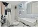 Modern bathroom with sleek fixtures, a stylish shower curtain, and ample lighting for a refreshing experience at 3425 S Atlantic Ave # 1206, Daytona Beach Shores, FL 32118