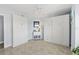 Bedroom features two Murphy beds, tile floor, and a storage cabinet at 3425 S Atlantic Ave # 1206, Daytona Beach Shores, FL 32118