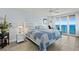 Serene bedroom features a plush queen bed, ocean view, and balcony access for tranquil relaxation at 3425 S Atlantic Ave # 1206, Daytona Beach Shores, FL 32118