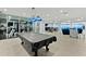 Large game room featuring a billiards table, gym, and ocean views at 3425 S Atlantic Ave # 1206, Daytona Beach Shores, FL 32118