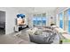 Bright living room with ocean view, contemporary furnishings, a TV, and access to a private balcony at 3425 S Atlantic Ave # 1206, Daytona Beach Shores, FL 32118