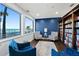 Enjoy the ocean views from this quiet sitting area, featuring a bookcase and comfortable seating at 3425 S Atlantic Ave # 1206, Daytona Beach Shores, FL 32118