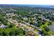 Expansive aerial view captures the residential neighborhood close to a tranquil lake at 3441 Country Walk Dr, Port Orange, FL 32129