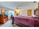 Main bedroom features a ceiling fan, plush carpets, and lots of natural light at 3441 Country Walk Dr, Port Orange, FL 32129