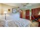 Cozy bedroom with neutral walls, ceiling fan, tile floor, and a double sized bed at 3441 Country Walk Dr, Port Orange, FL 32129