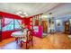 Warm dining room with red walls, tile floors, and a view of the entryway at 3441 Country Walk Dr, Port Orange, FL 32129