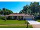 Charming single-story home with a well-maintained lawn, mature trees, and a two-car garage in a desirable location at 3441 Country Walk Dr, Port Orange, FL 32129