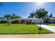 Charming single-story home with a well-maintained lawn, mature trees, and a two-car garage in a desirable location at 3441 Country Walk Dr, Port Orange, FL 32129