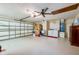 Spacious garage with laundry area, storage boxes, utility sink, and an automatic garage door at 3441 Country Walk Dr, Port Orange, FL 32129