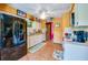 The spacious kitchen includes white cabinetry, tiled floors, stainless steel appliances and breakfast area at 3441 Country Walk Dr, Port Orange, FL 32129