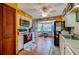 The kitchen is complete with white cabinetry, stainless steel appliances, and an eat-in breakfast nook at 3441 Country Walk Dr, Port Orange, FL 32129