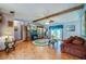 Bright living room with tile flooring, exposed beam, and classic furnishings at 3441 Country Walk Dr, Port Orange, FL 32129