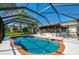 Sparkling pool in screened enclosure, providing a perfect backyard for relaxation and entertainment at 3441 Country Walk Dr, Port Orange, FL 32129