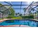 Screened-in pool area offering a private and refreshing outdoor space at 3441 Country Walk Dr, Port Orange, FL 32129