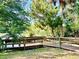 Inviting wooden boardwalk and bench offer scenic views of the waterway and lush natural surroundings at 370 S Center St, Ormond Beach, FL 32174