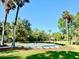 Outdoor community space featuring a gazebo, green lawn, and palm trees at 370 S Center St, Ormond Beach, FL 32174