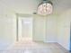 Bright dining room featuring tiled floors and an elegant chandelier at 370 S Center St, Ormond Beach, FL 32174