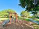 Outdoor exercise area with various fitness machines, walking path, and lush green surroundings at 370 S Center St, Ormond Beach, FL 32174
