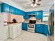 The kitchen features stainless steel appliances, including a range and microwave at 370 S Center St, Ormond Beach, FL 32174