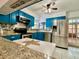 The kitchen features stainless steel appliances and granite countertops at 370 S Center St, Ormond Beach, FL 32174