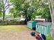 Large backyard featuring two storage sheds and green space, perfect for outdoor activities at 370 S Center St, Ormond Beach, FL 32174