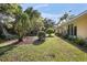 Lawn and landscaping in the backyard of the house at 405 Secluded Oaks Trl, Deland, FL 32724
