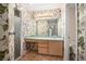 Bathroom with floral wallpaper, vanity, sink, shower, and toilet at 405 Secluded Oaks Trl, Deland, FL 32724