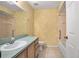 Bathroom featuring a sink, vanity, toilet, and shower-tub combo at 405 Secluded Oaks Trl, Deland, FL 32724