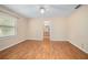 Bedroom featuring light walls and flooring, with a bathroom connected at 405 Secluded Oaks Trl, Deland, FL 32724