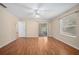 Bedroom featuring light colored flooring, walls, and access to the patio at 405 Secluded Oaks Trl, Deland, FL 32724