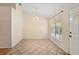 Cozy dining area featuring tile floors, a large window, and neutral wall paint at 405 Secluded Oaks Trl, Deland, FL 32724
