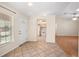 Bright entryway with tile flooring, leading to the kitchen and living area at 405 Secluded Oaks Trl, Deland, FL 32724