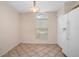 Charming kitchen nook featuring tile floors, natural light, and white appliances at 405 Secluded Oaks Trl, Deland, FL 32724