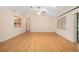 Open living area with hardwood floors, vaulted ceilings, and lots of natural light at 405 Secluded Oaks Trl, Deland, FL 32724