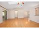 Bright living room featuring hardwood floors, a ceiling fan, and sliding glass doors at 405 Secluded Oaks Trl, Deland, FL 32724