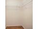 Spacious walk-in closet equipped with metal shelving at 405 Secluded Oaks Trl, Deland, FL 32724