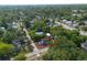 Aerial view of a well-kept home with front porch with a fenced yard, close to downtown at 415 W Church St, Deland, FL 32720